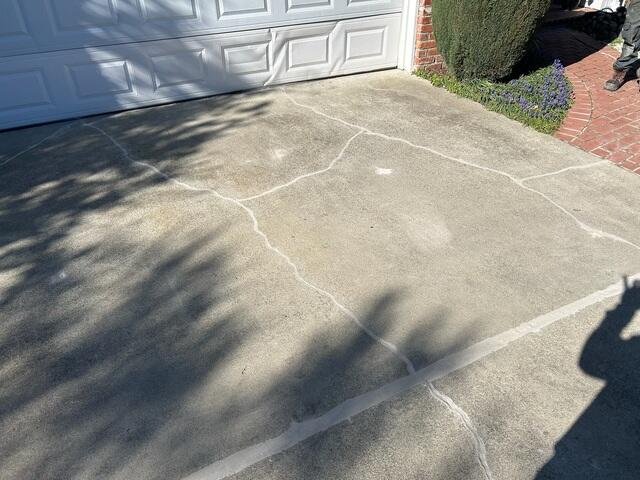 Additional image showing the lifted and sealed driveway.