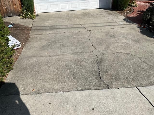 Additional wider image of the cracking and settlement on the driveway of this Orinda home.