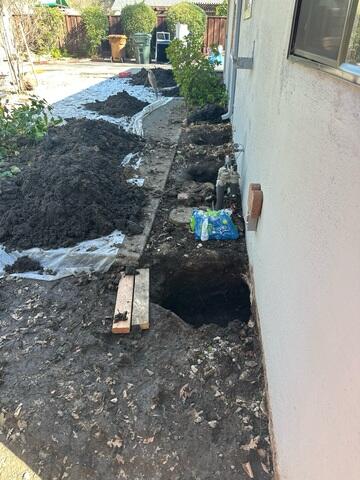 Progress image showing the excavation done to prepare for the installation of the push piers.