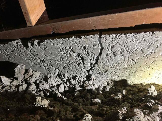 Before image showing cracking in the perimeter foundation wall.