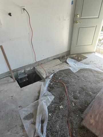 Progress image showing the concrete cut and excavation in preparation for the installation of a push pier.