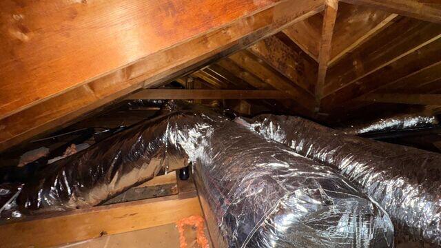 Some of the attic while being air sealed.