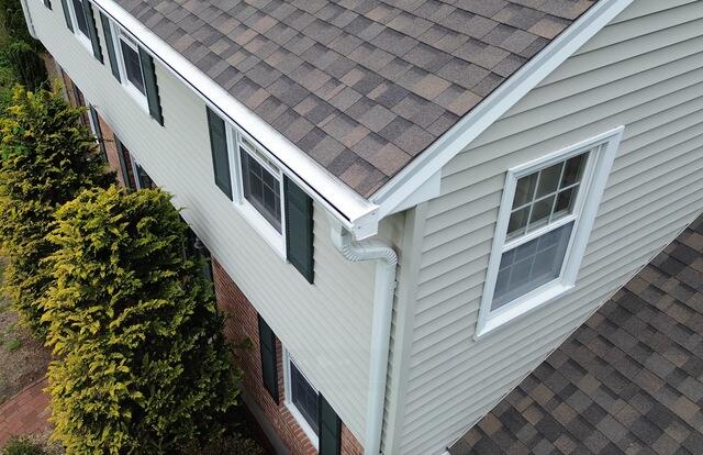 This close-up shot highlights the newly installed Gutter Shutter System on Brenden and Hope's home. After dealing with a failed gutter guard system that had been nailed through their shingles, our team came to do the job right. We installed the Gutter Shutter System, which is securely mounted without ever touching the shingles, providing long-lasting protection without compromising the roof. Now, their home is equipped to handle heavy rain, and they won't have to worry about sagging, clogging, or future damage with the Gutter Shutter Guarantee.