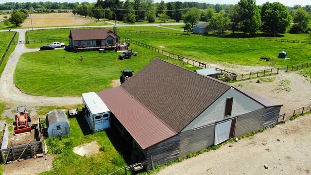 Completed barn roof project with asphalt shingles and metal roofing, installed safely on a live agricultural site in New Castle County, DE.