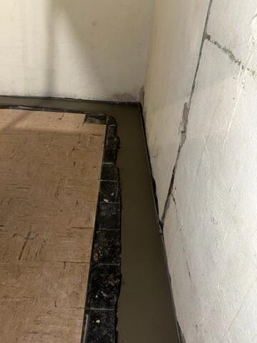 Our crew installed the WaterGuard Drainage System along the basement perimeter to intercept and collect water at the wall-floor joint.