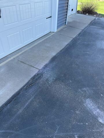 During: Our Foreman, Jordan, and his crew lifted and leveled the sidewalk back into place.