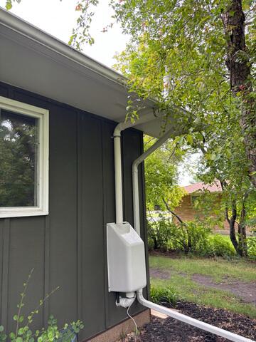 After: Jackson, our Radon Sales & Service Technician, installed the system outside the home.
