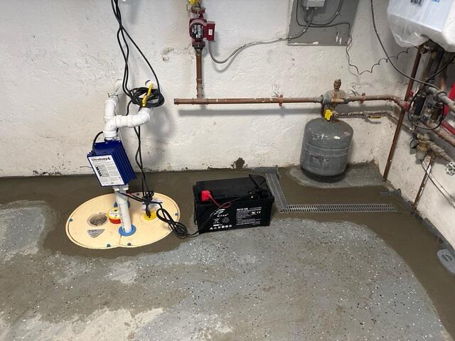 To provide complete protection against water intrusion, our crew installed TrenchDrain to stop surface water at entry points, the WaterGuard System to capture wall and floor seepage, and the TripleSafe Sump Pump for powerful, reliable water removal.