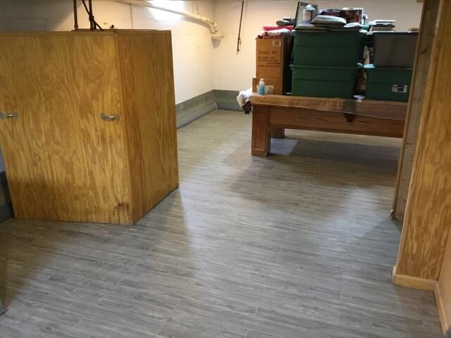 This photo shows our ThermalDry Elite Plank Flooring in the gray colorway. These panels provide a thermal break between the concrete slab and the floor. They can not be damaged by moisture, and mimic real wood.