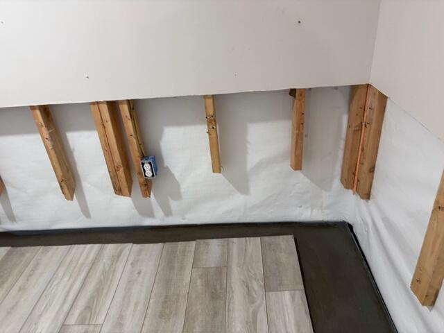 We installed CleanSpace Wall Panels and our WaterGuard system to create a moisture-resistant barrier that protects basement walls and directs water safely away from the foundation, keeping the space dry and damage-free.