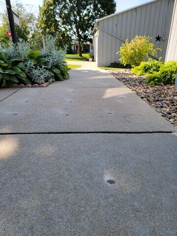 During: The Design Specialist suggested installing PolyLevel under the struggling sidewalk.