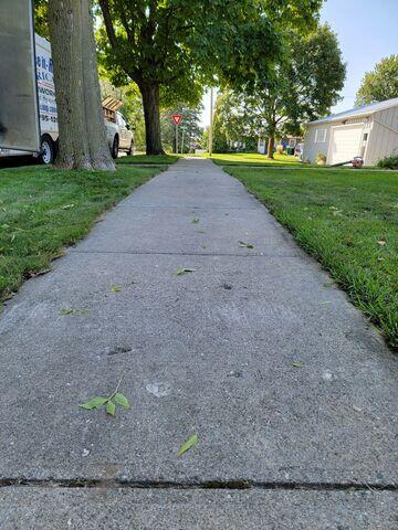 After: Our Foreman, Sam, successfully lifted the sidewalk back into place.