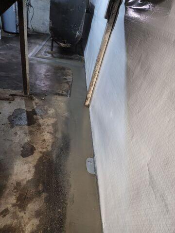 We chose our WaterGuard System for its ability to discreetly capture and redirect water seepage at the foundation's edge, protecting the basement without disrupting the floor.