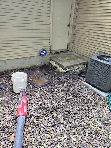 During: Our Foreman, Sam, and his crew inserted PolyLevel below the sinking concrete step.