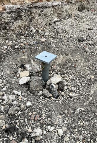 Helical pier with new construction cap installed