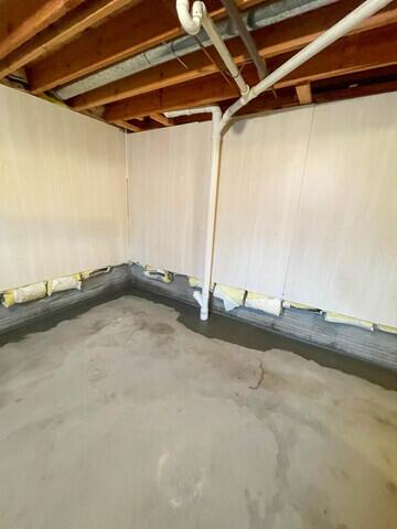 This image showcases the successful outcome of a comprehensive basement waterproofing solution in Nashua, IA. Featuring the integrated WaterGuard Perimeter Drainage System, CleanSpace Wall System, and an upgraded TripleSafe Sump Pump, this basement is now expertly protected against water intrusion, ensuring a dry, healthy, and resilient foundation for the homeowner.