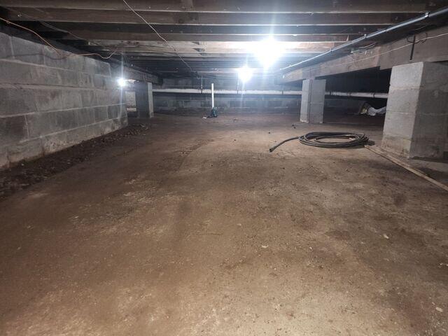 The crawl space in Paramus, NJ showed clear signs of moisture buildup, poor insulation, and potential mold risk, leading to musty odors and indoor air quality concerns.