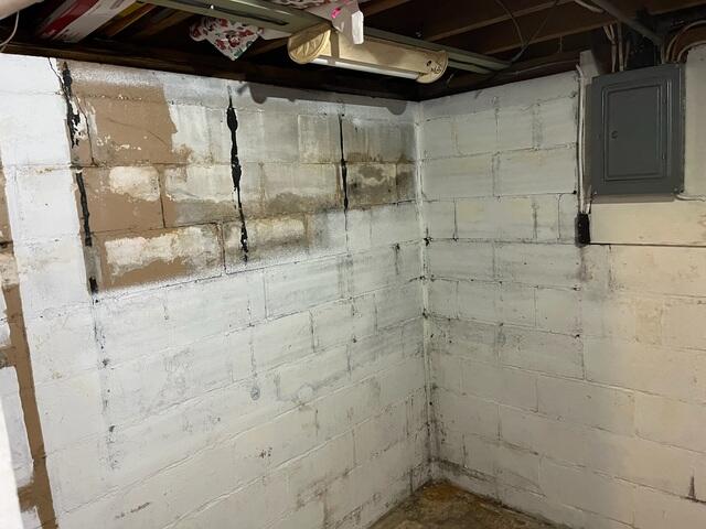Before: Signs of water damage can be seen along the walls and edges of the floor