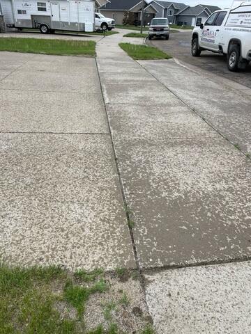 During: Our Foreman, Charlie, and his crew successfully lifted the driveway back to its original position.