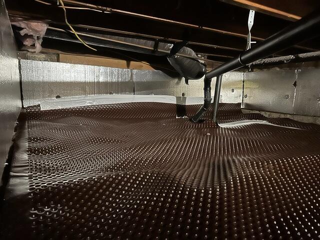 First, our Drainage Matting was installed to effectively channel and divert moisture away from the crawl space, preventing water buildup that can lead to mold and structural damage.