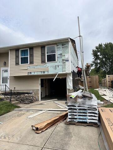 Siding Replacement: Here we are replacing the siding, making sure our vapor barrier is properly sealed against the home beforehand.