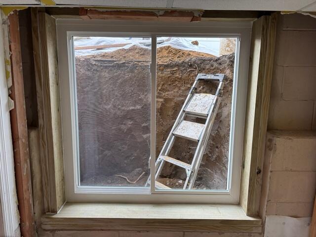 Our crew began by excavating the soil around the foundation and carefully cutting an opening in the wall to fit the new Egress Window, ensuring it met safety and code requirements.