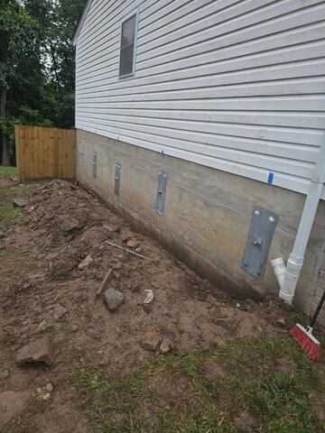 We installed 9 GeoLock® Wall Anchors to stabilize the foundation walls and prevent further bowing or inward movement. These anchors are designed to stop wall failure by using the strength of stable soil outside the home. This proven solution is ideal for homes in Chantilly, VA where pressure from expanding soil can cause serious foundation wall issues. Now, the walls are secure, and the home is structurally sound.