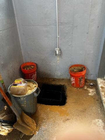 Drain by basement entrance beginning of installation