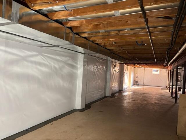CleanSpace wall liner brightens and seals the basement while directing moisture to the hidden WaterGuard system below the floor. This complete setup keeps the space dry, healthy, and ready for use.