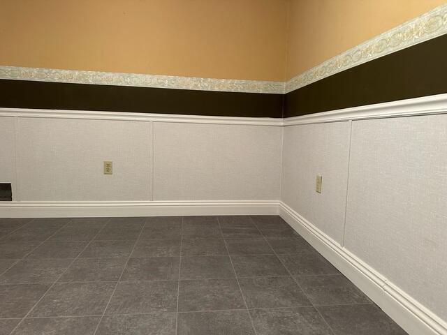 After waterproofing and refinishing, the basement is now clean, dry, and protected, featuring ThermalDry tiled flooring and restored lower walls with EverLast panels.