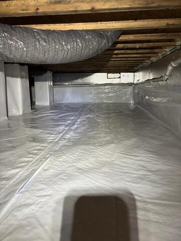 After the upgrade: CleanSpace, SilverGlo insulation, and the SaniDry Sedona work together to keep this crawl space dry, energy-efficient, and protected.