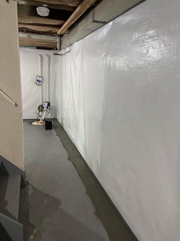 CleanSpace was added along the basement walls to seal out moisture, brighten the space, and prevent mold growth.
