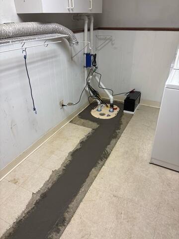 Our crew installed the sump pump at the corner of the room