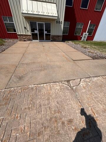 Before: Will, one of our Design Specialists, recommended lifting and leveling the concrete back into place.