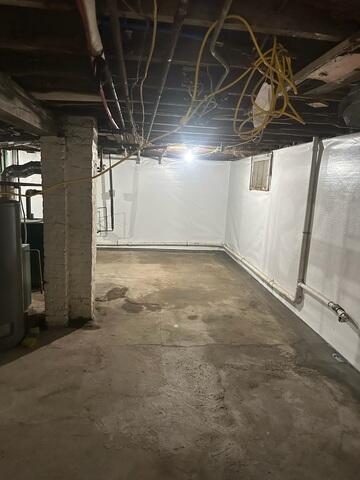 CleanSpace vapor barrier was installed to seal the basement walls from moisture and musty odors.