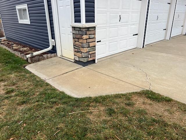 A closer angle at the driveway and walkway to the garage