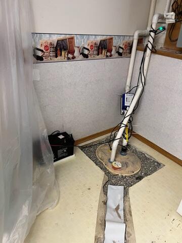 Our crew in the process of installing our sump pump