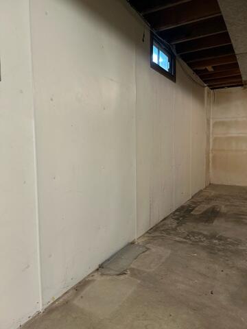 Before: signs of water intrusions can be seen along the perimeter of the basement