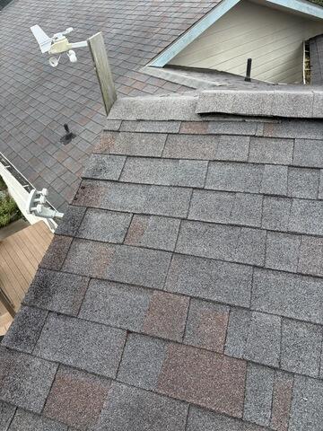 BEFORE: This roof did not have proper flashings, moss was beginning to grow in the valleys, and much of this old roof was improperly installed. It was time for a full roof replacement.