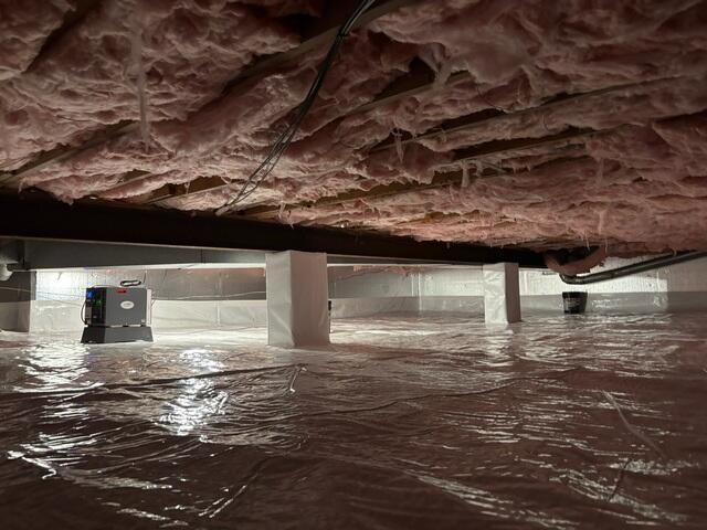 Finished crawl space with CleanSpace and SaniDry Sedona for year-round moisture control.
