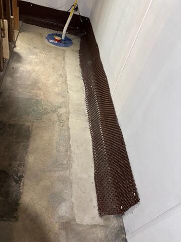 We installed our WaterGuard Drainage System and Drainage Matting to effectively capture and redirect groundwater before it reaches the basement floor, keeping the space dry and protected from long-term moisture damage.