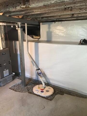 During: Dylan, one of our Design Specialists, recommended installing several waterproofing products throughout the basement.