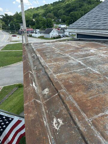 This is what the roof above the porch looked like before we replaced it. We also replaced this gutter system.