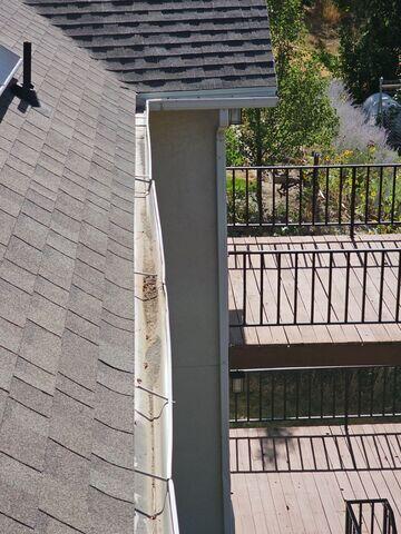 leaves and buildup caused bent gutters
