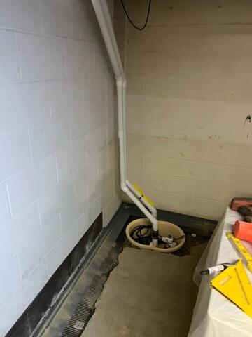 During: Our Foreman, Kevin, and his crew secured all the waterproofing products throughout the basement.