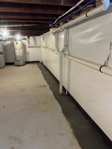 With CleanSpace wall liner and the WaterGuard drainage system installed, the basement is now clean, bright, and fully protected against water seepage.