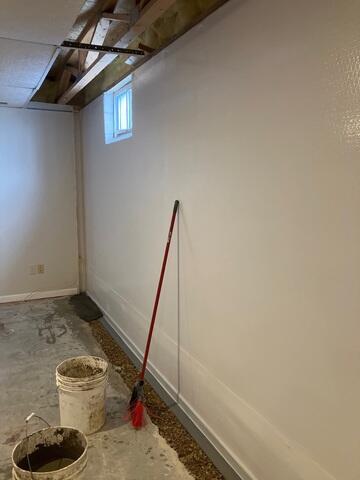 During: The crew covered the wall with CleanSpace and installed WaterGuard at the perimeter