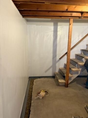 During: The crew attached CleanSpace to the walls and are in the process of installing WaterGuard