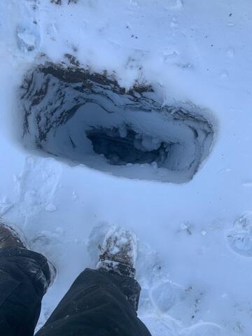 A hole is dug out and the earth anchor is placed inside