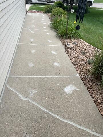 After: Charlie and his crew finished the project by securing NexusPro in the cracks and joints of the walkway.